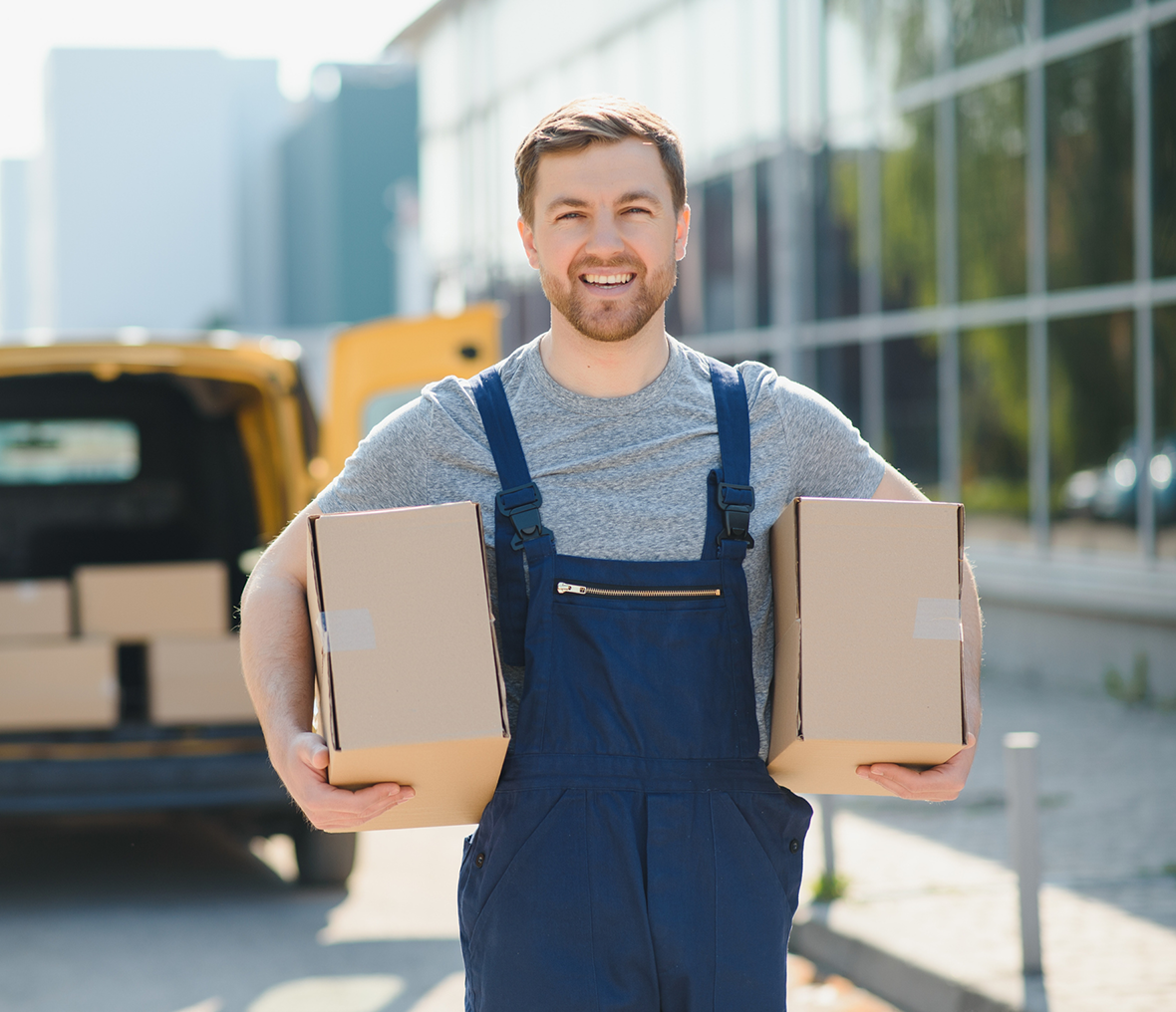 Courier smiling with packages